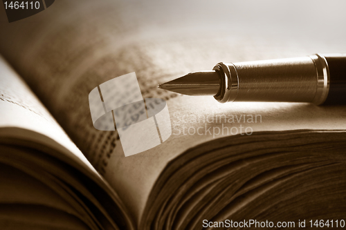 Image of Old book and pen