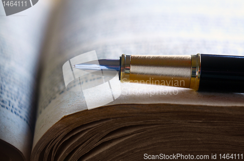 Image of Old book and pen