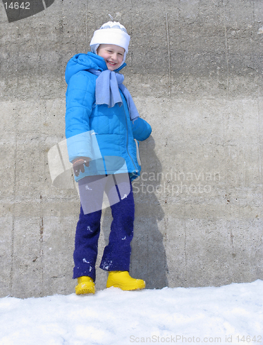 Image of Young girl near the concrete wall