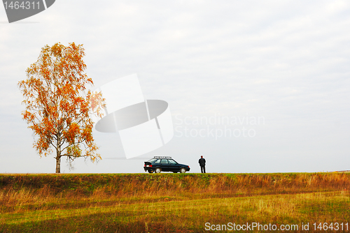Image of one person close to the car 