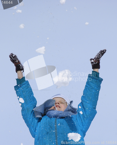 Image of Young girl playing with snow