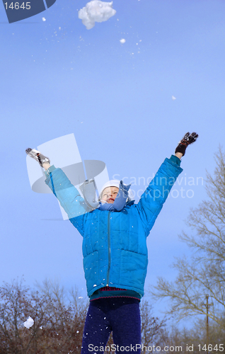 Image of Young girl playing with snow