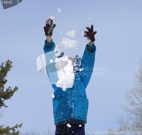 Image of Young girl playing with snow