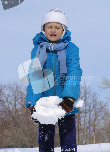 Image of Young girl playing with snow