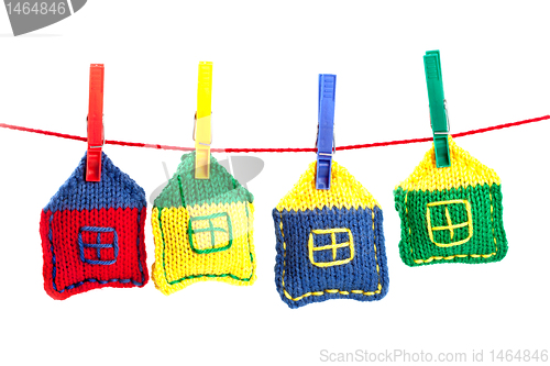 Image of four knitted colorful houses 