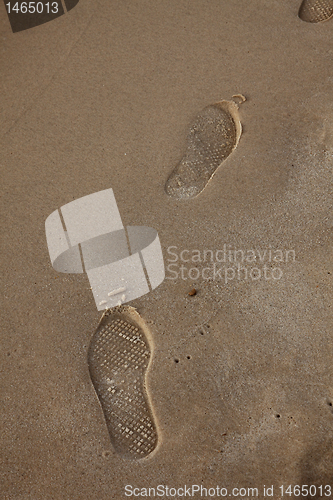 Image of Human trace of a foot on sand