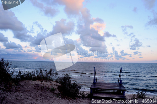 Image of Stairs in dunes and sea view. Natural sea and sky.