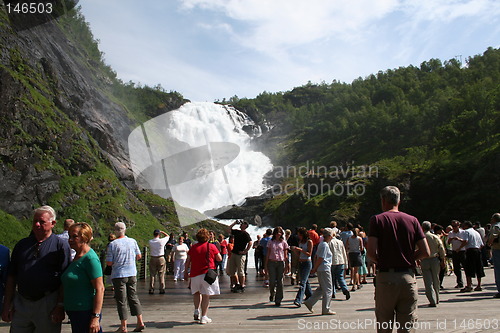 Image of Tourists by the waterfall