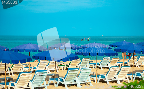 Image of Sandy Beach with Loungers and Umbrellas