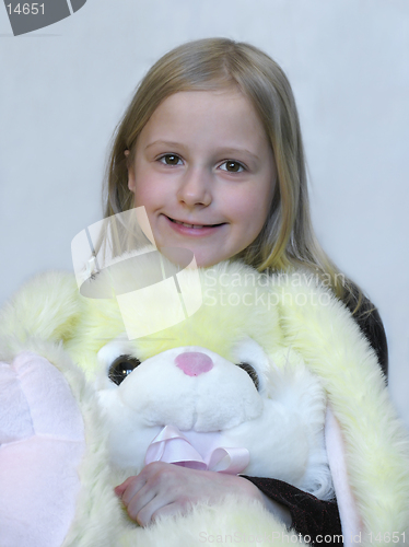 Image of Happy young girl with lovely toy