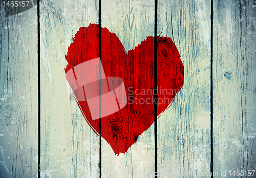 Image of love symbol on old wooden wall