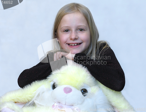 Image of Happy young girl with lovely toy