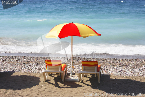 Image of Beach chairs and umbrella