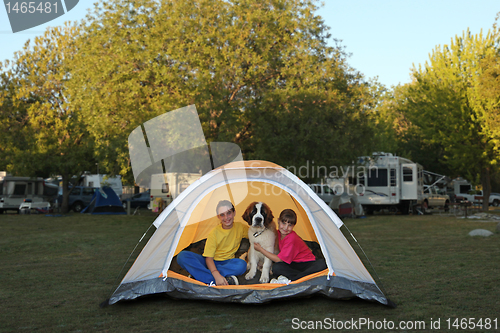Image of Girls and Dog in a Tent While Camping 