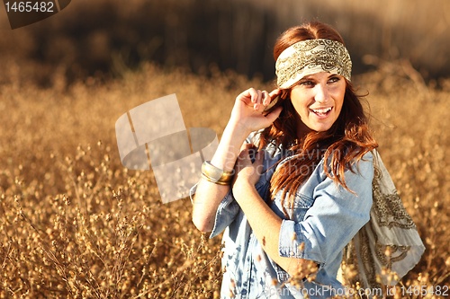 Image of Beautiful Woman on a Field in Summertime 
