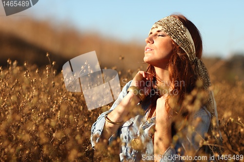 Image of Beautiful Woman on a Field in Summertime 