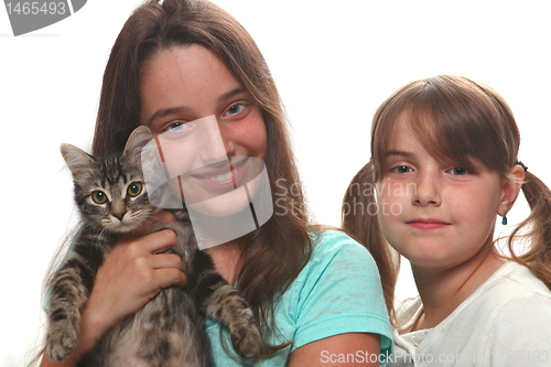 Image of Two Sisters Holding Their Young Kitten