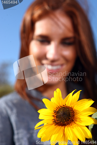 Image of Red Haired Woman Outdoors in a Sunflower Field