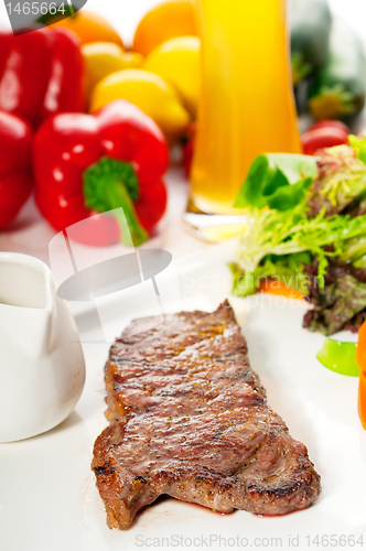 Image of juicy BBQ grilled rib eye ,ribeye steak and vegetables