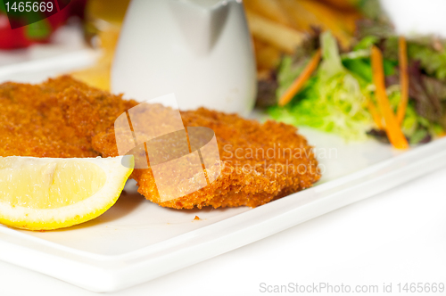 Image of classic Milanese veal cutlets and vegetables