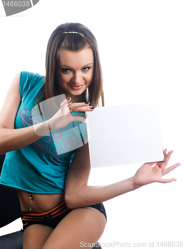 Image of Young beautiful woman holding blank poster