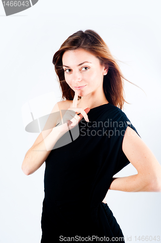 Image of Woman making a keep it quiet gesture