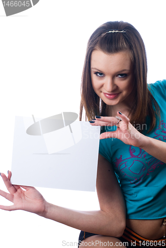 Image of Young beautiful woman holding blank poster