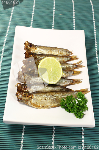 Image of sprats with lemon