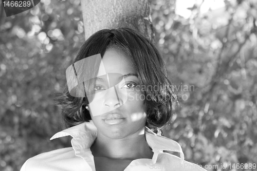 Image of African American Woman Leaning Tree Black White