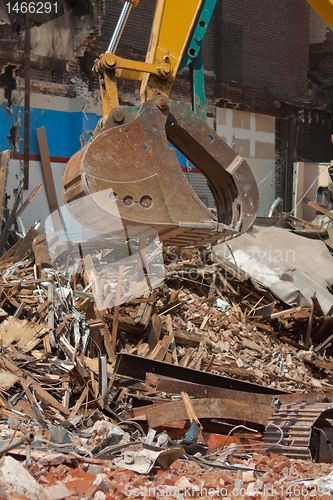 Image of Demolition Equipment Claw, Pile of Debris at Work Site