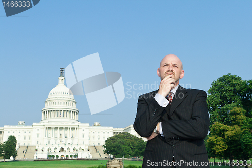 Image of Thoughtful Caucasian Man Suit Standing US Capitol