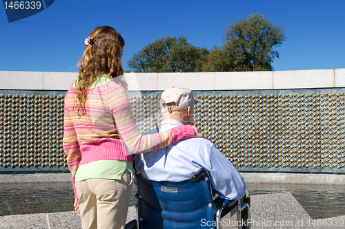 Image of Grandfather Granddaughter Wheelchair WWII Memorial