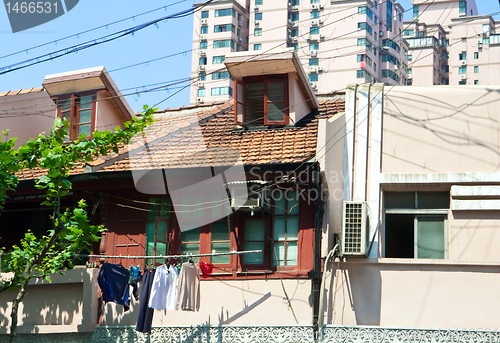 Image of Old Home Laundry and Wires Contrast New Apartment Homes Shanghai