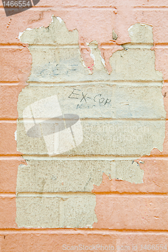 Image of XXXL Paint Peeling Off Grungy Beige Brick Wall Grafitti Cop