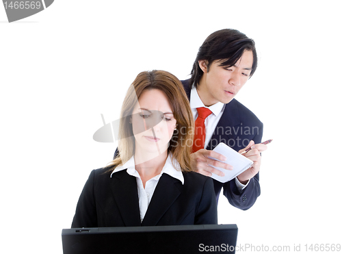 Image of Asian Man Looking Over Shoulder Surfing, Copying,  Caucasian Wom