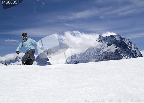 Image of Snowboarding in high mountains