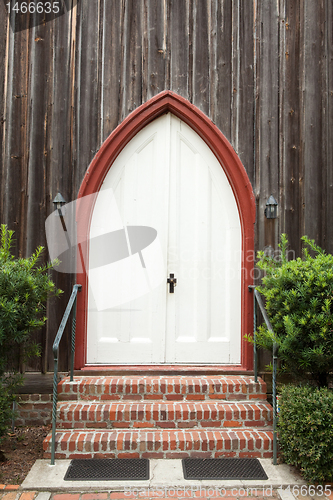 Image of Arched Gothic Church Door Wood Building Cross