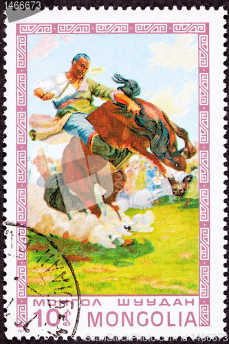 Image of Canceled Mongolian Postage Stamp Bucking Bronco Man Breaking Wil