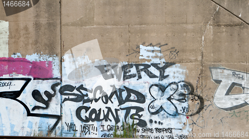 Image of Every Second Counts Graffiti on Cement Wall