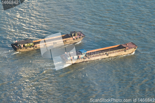 Image of Barges On Huangpu River, Shangha, China, at Sunset