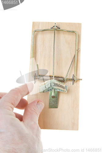 Image of Hand Grabs $20 Dollar Bill in Mousetrap Isolated
