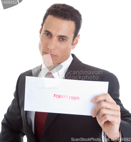 Image of Serious Caucasian Man Holding a Foreclosure Notice, White Backgr