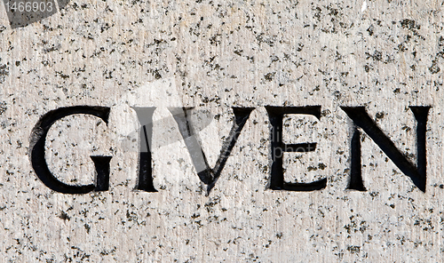Image of Word "Given" Carved in Gray Granite Stone