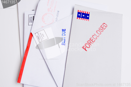 Image of Pile Mail Stamped FORECLOSED PAST DUE Isolated