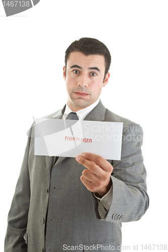 Image of Unhappy Hispanic Man Suit Holding Foreclosure Notice White Backg