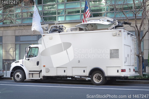 Image of Television News Truck Van, Satellite Dish Roof, Parked on Street