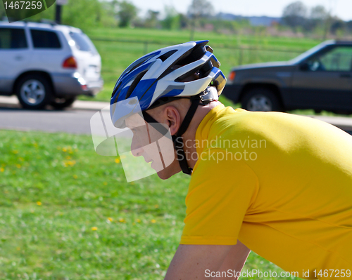 Image of Senior Caucasian Man Biking with Shirt Bike Helmet