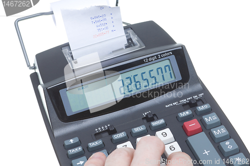 Image of Hand Using Adding Machine, LCD, Tape, Isolated