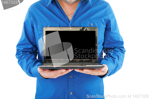 Image of Businessman holding an open laptop. Isolated on white background