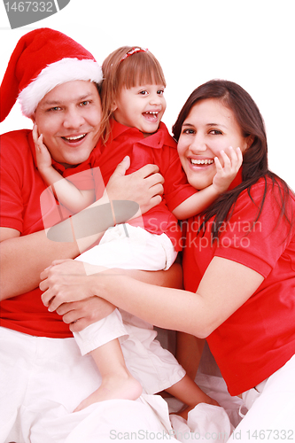 Image of Portrait of happy family looking at camera and prepared for Chri